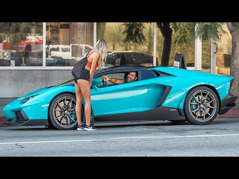 Luxury car parked outside fast food restaurant